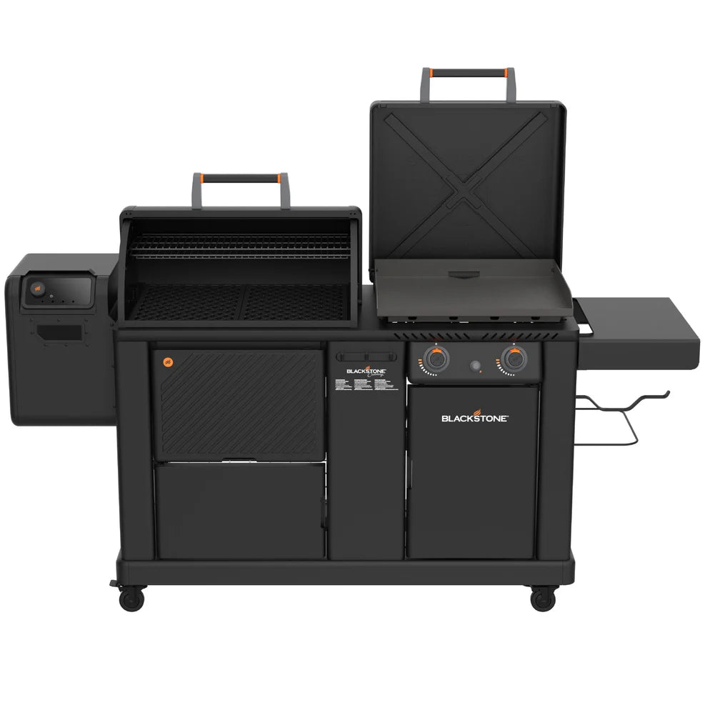 Blackstone dual fuel outdoor grill with a side burner, main grill chamber with lid open, lower storage cabinets, and side table on a white background.